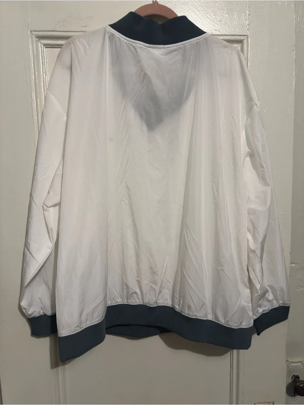 New With Tags Women’s White Pullover Windbreaker with Green trim. Size XL.